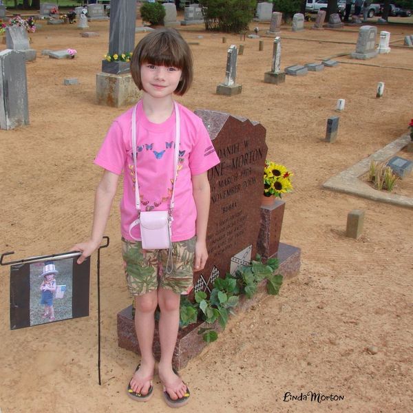 Alisha at her Daddy's grave....2008...