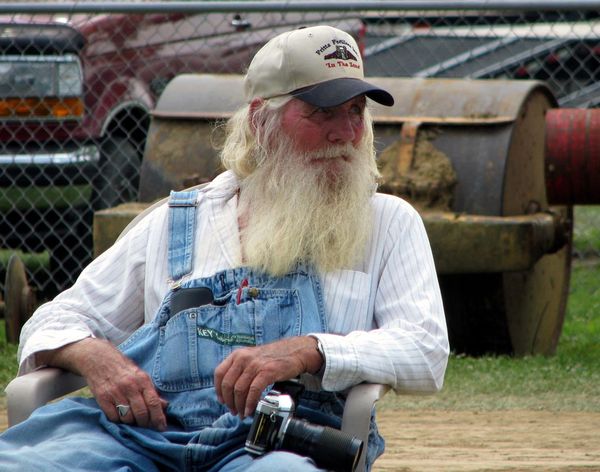 Die-Hard Photographer at a Fair Tractor Pull...