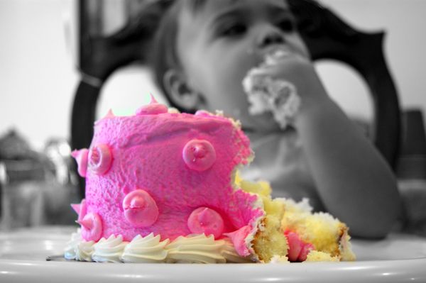 eating her 1st bday cake=]...