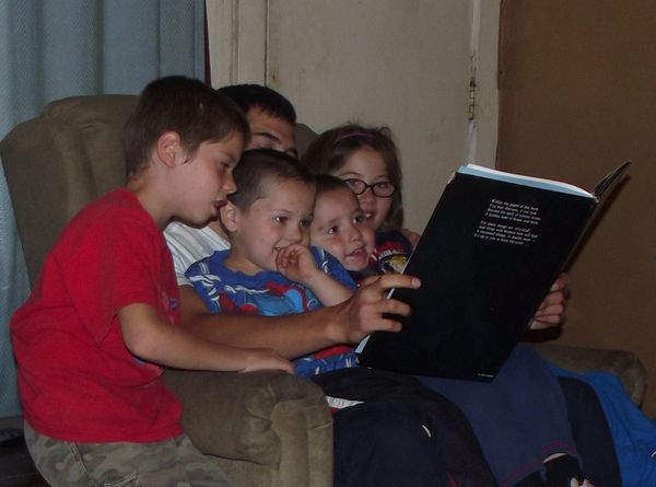 my son reading to his children...