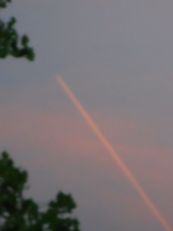 sunset with jet vapor trail....