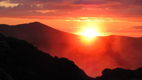 Sunset over steamy lava...