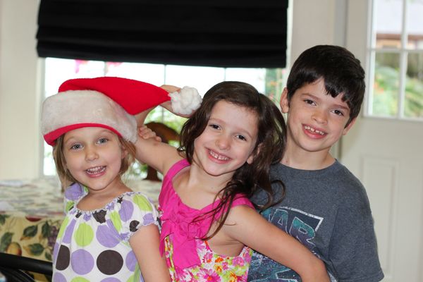 3 kids and a Santa hat...