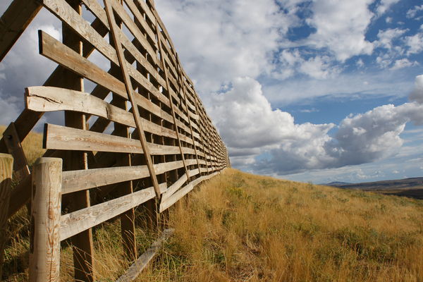 I am fascinated with these huge snow fences in Wyo...
