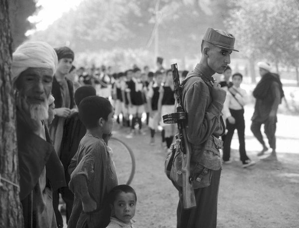 Young soldier and school parade, Kandahar, 1972....