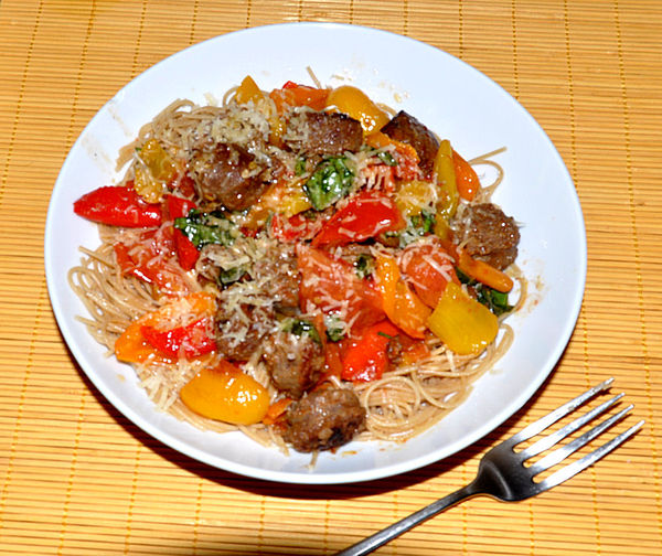 Italian Sausage, peppers, tomatoes over whole whea...