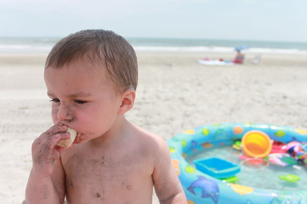 Here is my Son eating a sandy banana on the beach ...