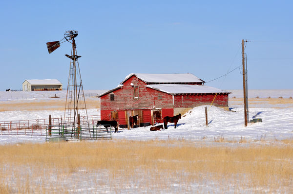 Red barn, White snow and Blue sky...