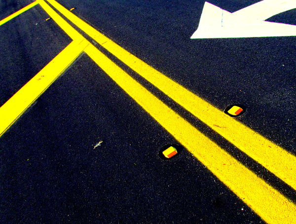Double Yellow Lines on Asphalt[Im intrigued by the...