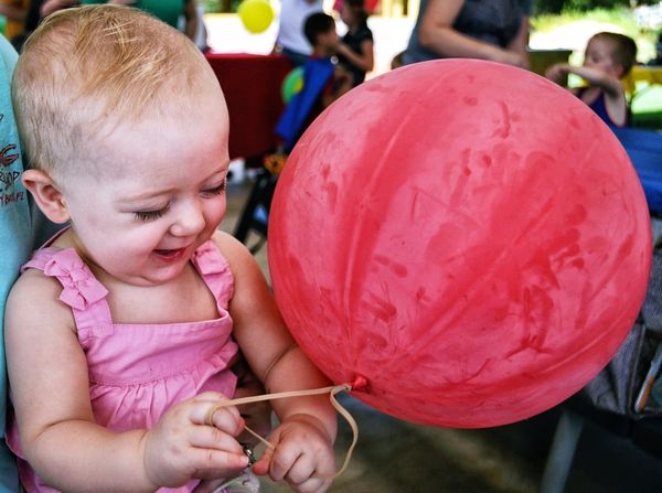 Caroline enjoying a birthday bouncy balloon at  a ...