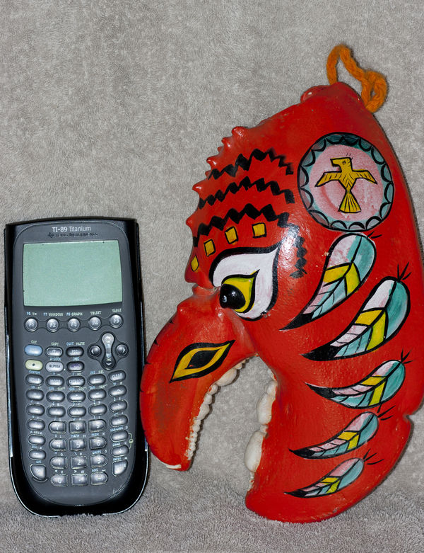Next to a TI -89 for size comparison...