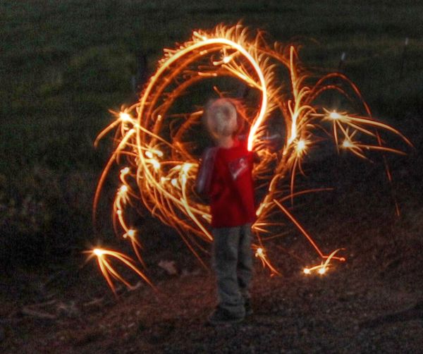 little boy playing with fire...