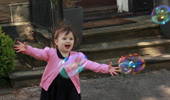 Granddaughter chasing bubbles.  The choice was to ...