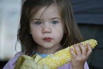 Eva and her corn. I shot this at a family gatherin...