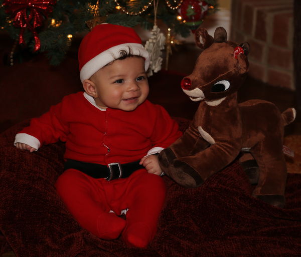 Landon under the tree with Rudolf!...
