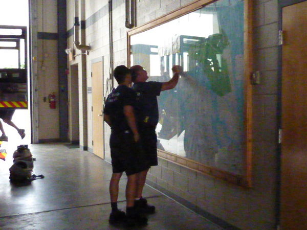 Firefighters checking their map after a call came ...