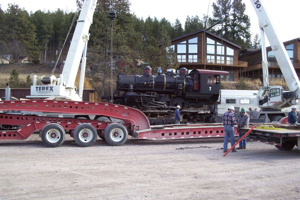 Here is the Loco in the air starting to be loaded ...