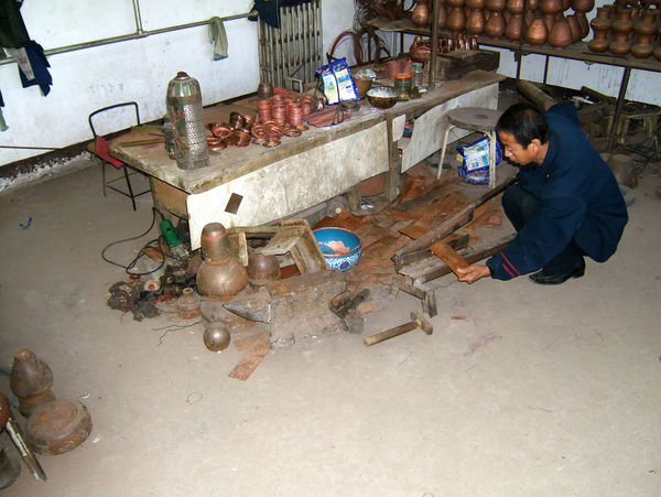 Making copper vases...