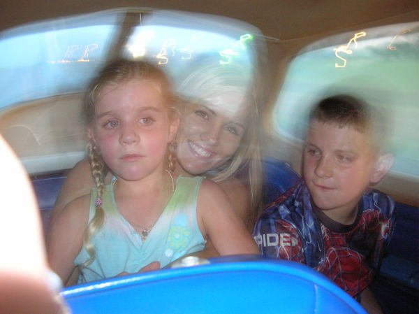 My grandkids in the back seat with their aunt Holl...