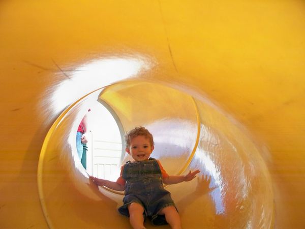grandson going down a slide....