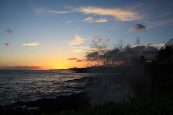 Sunset with wave crashing on lava...