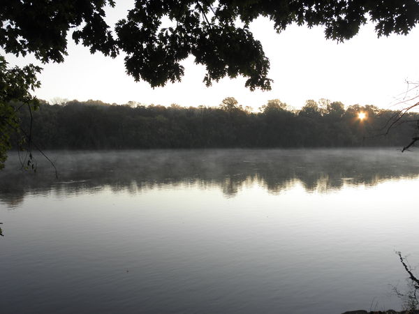 sunrise on steamy/foggy river...