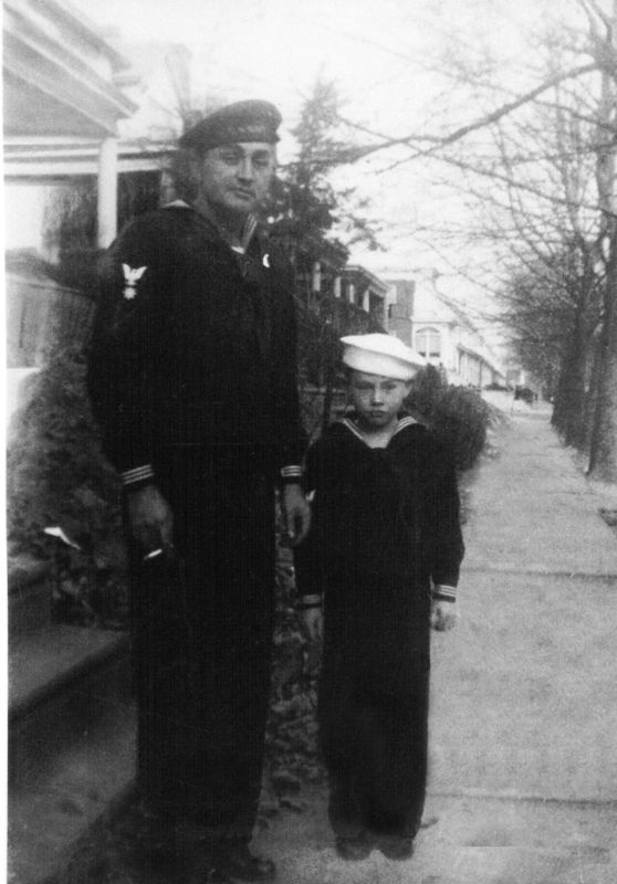 Bob in a cut down uniform with his dad in 1943...