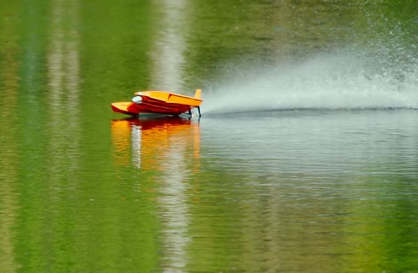 A toy speed boat at the park...