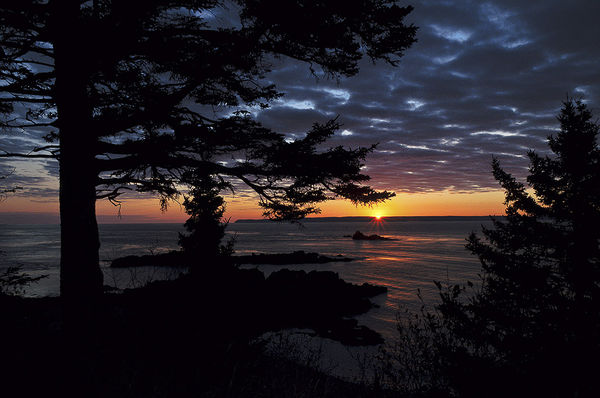 Sun rising over Grand Manan island, New Brunswick,...