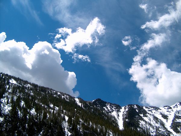 Looking up from Dolus Lake No. 1 at the clouds as ...