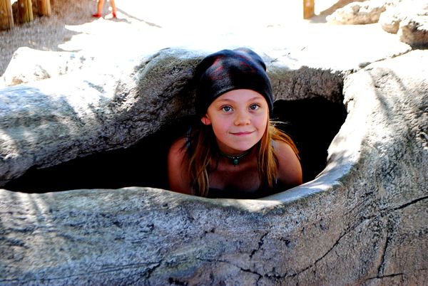 A little boy was bothering her, so she hid in a lo...