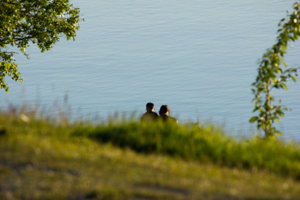 a couple watching the midnight sun...
