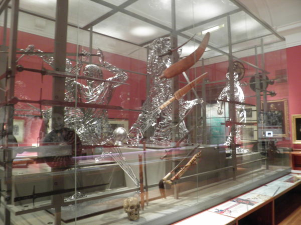 metal statues inside glass case Kelvin Museum Scot...