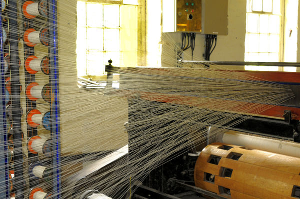 thread being woven into cloth...