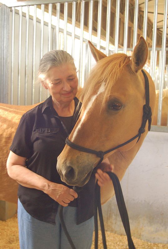 My sister, at age 66, with her first horse on thei...