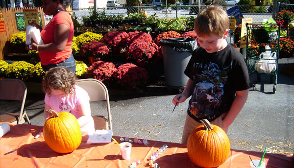 Kids painting pumpkins at a local garden center...