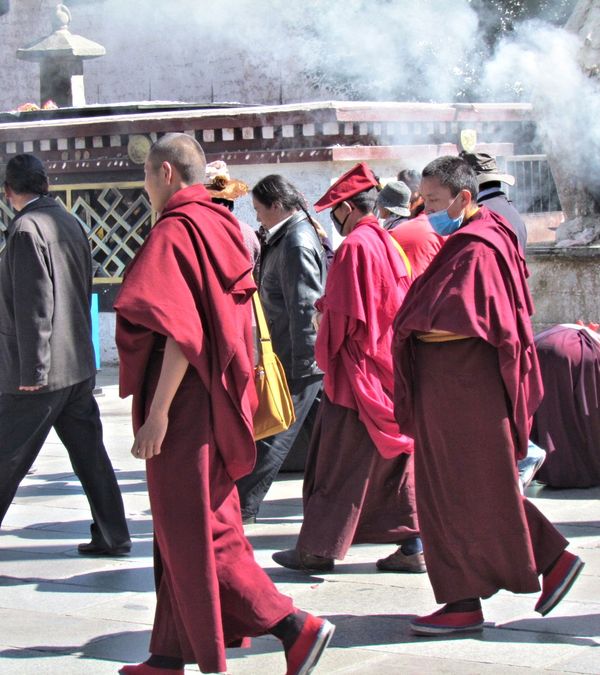 Monks strolling through the incense smoke...