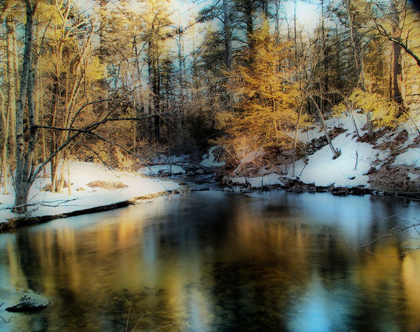 thaw, long exposure on a slow moving pond, digital...