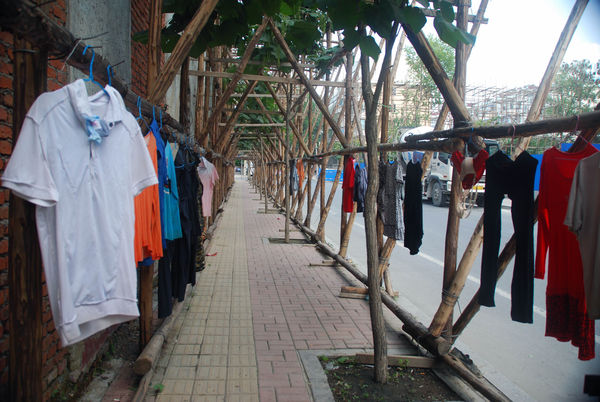 Clothes drying on bamboo scaffolding outside a pub...