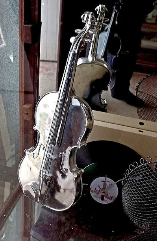 Junk shop silver violin...