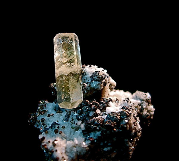 Yellow calcite crystal on quartz and pyrite matrix...