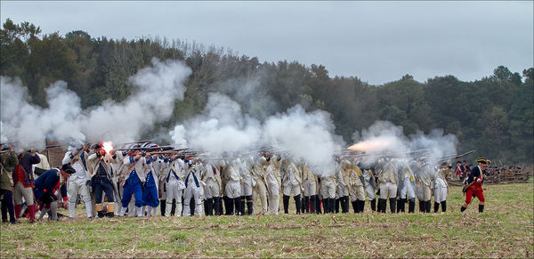 French forces fire musket volley...