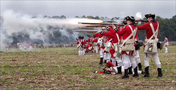 British forces fire musket volley...