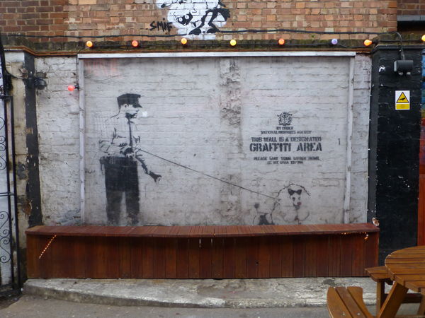 Probably one of the best known artists:  Banksy...