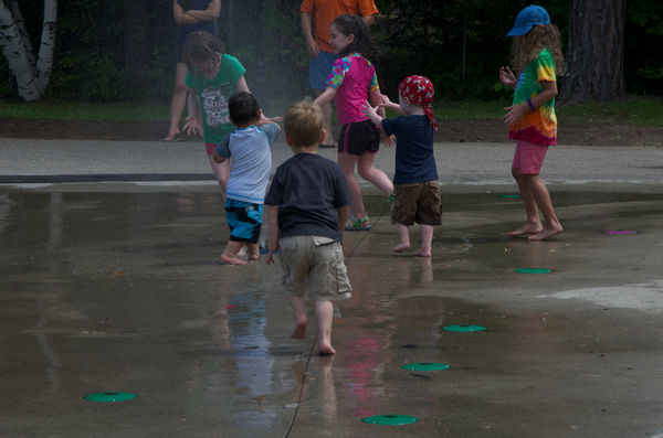 A hot summer's day at a park's misting playground...