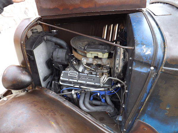 It has a 350 Chevy Block and headers leading to st...