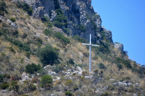 Cross on the mountain for someones resting place....