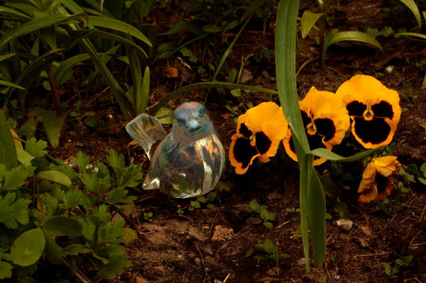 Fenton glass in flower garden...