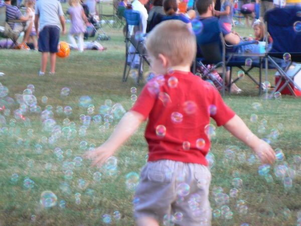 Grandson playing in the bubbles...