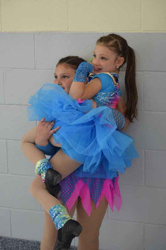 My granddaughter being held up by her friend Lena...